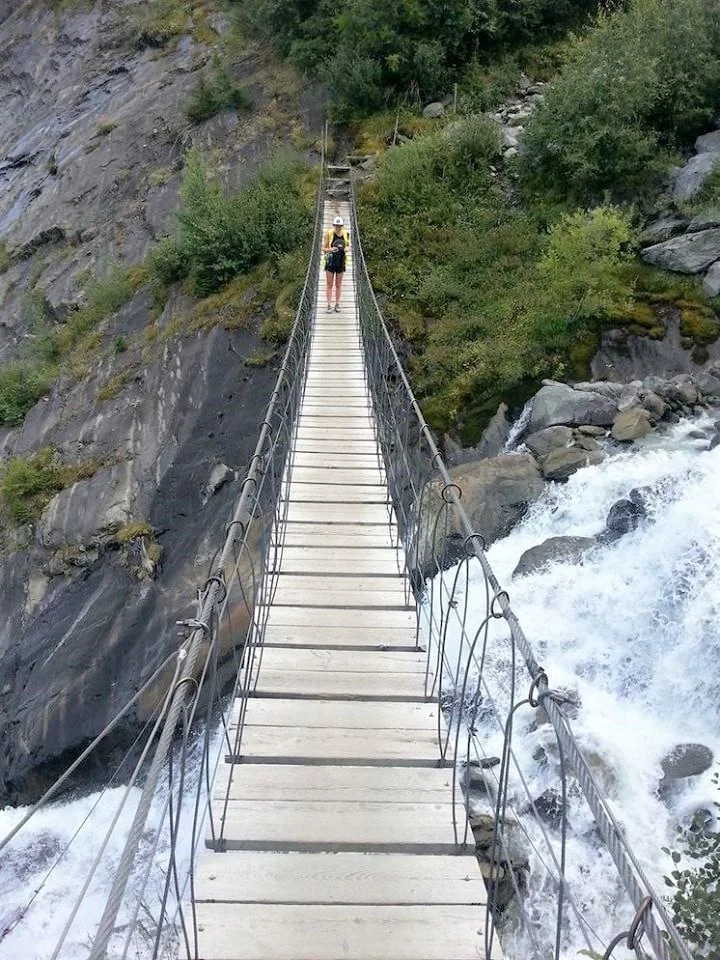 milly-on-the-bridge-above-meltwater-from-the-bionnassay-glacier Tour du Mont Blanc