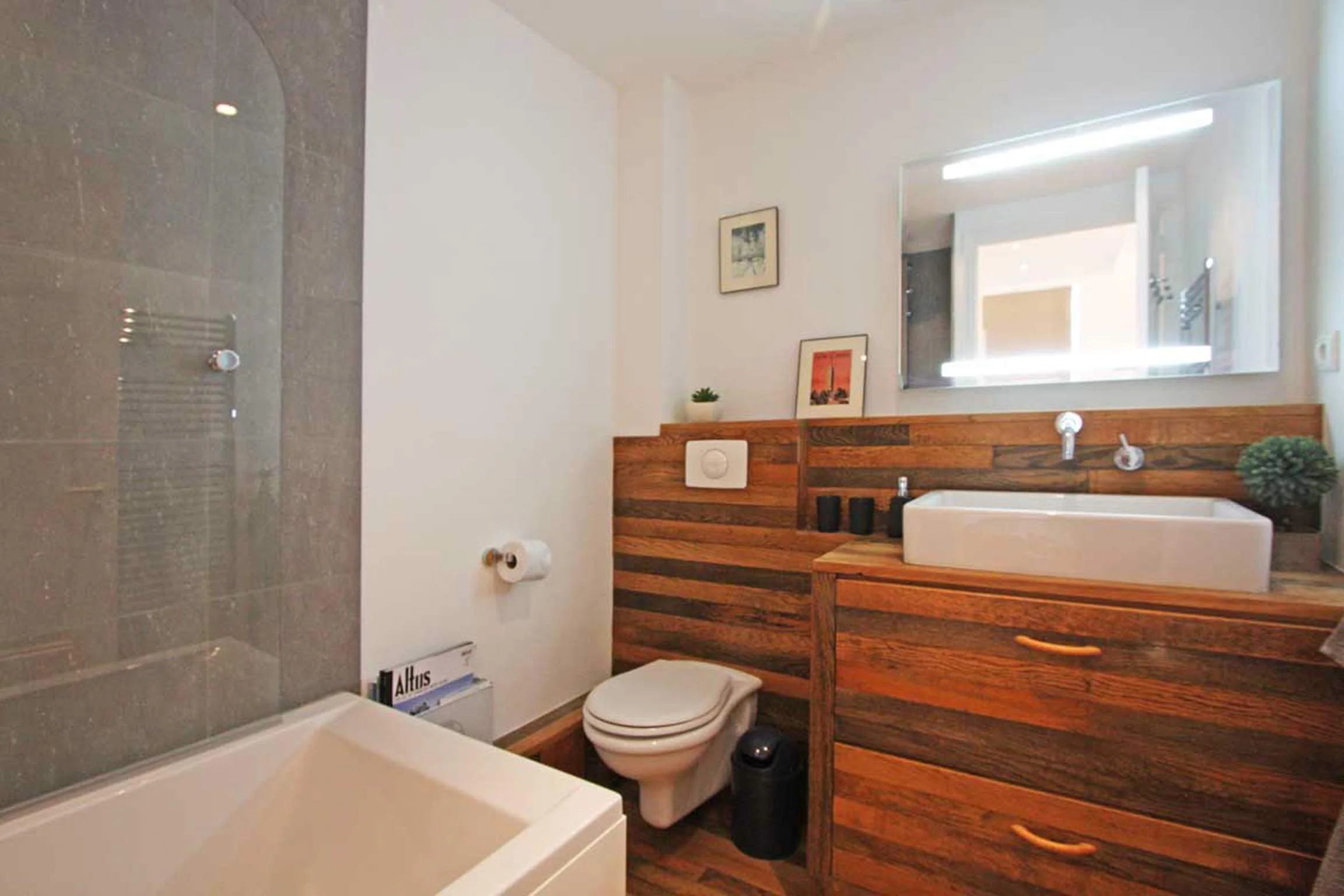 Family bathroom with bath and overhear shower