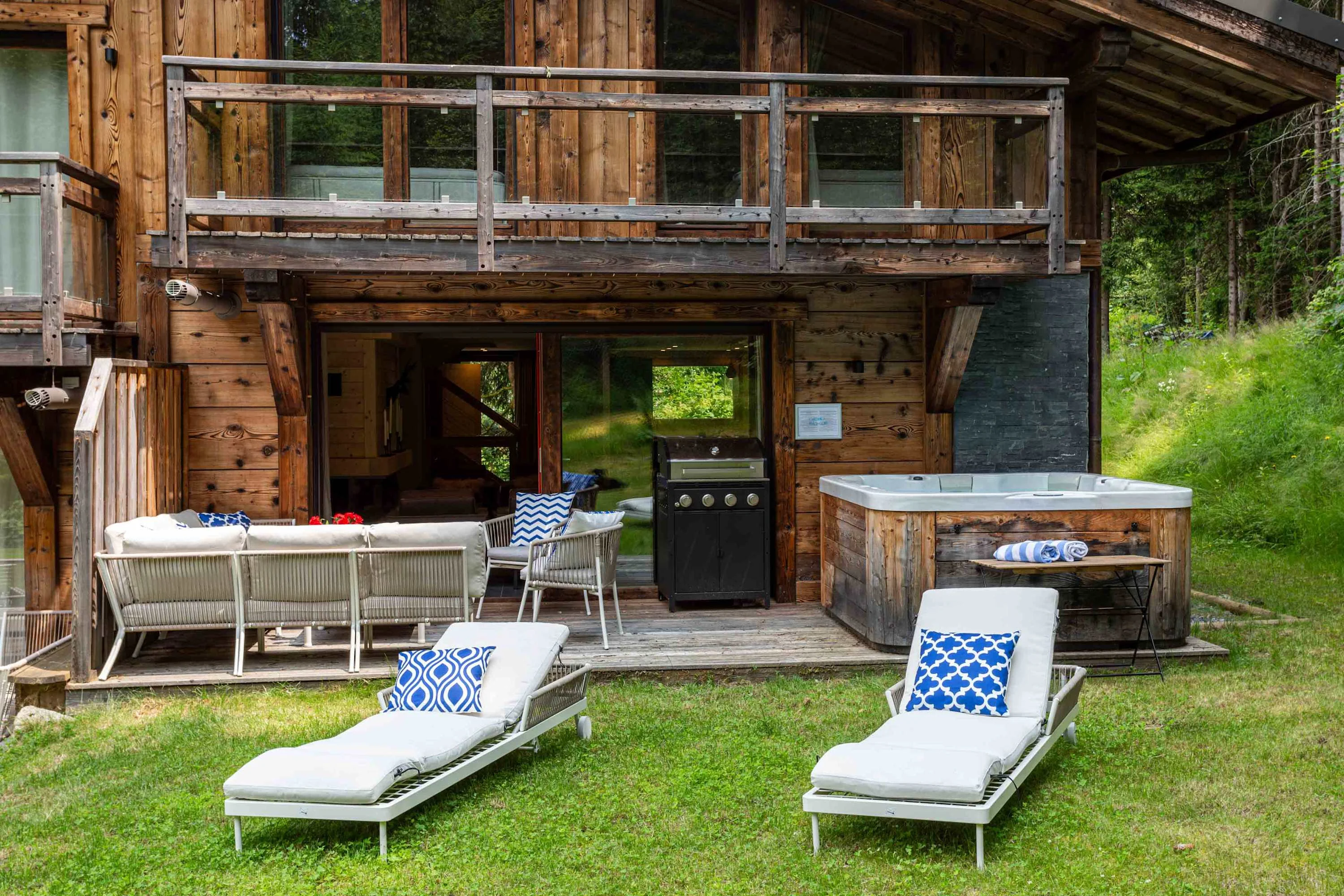 Garden with sun loungers and hot tub
