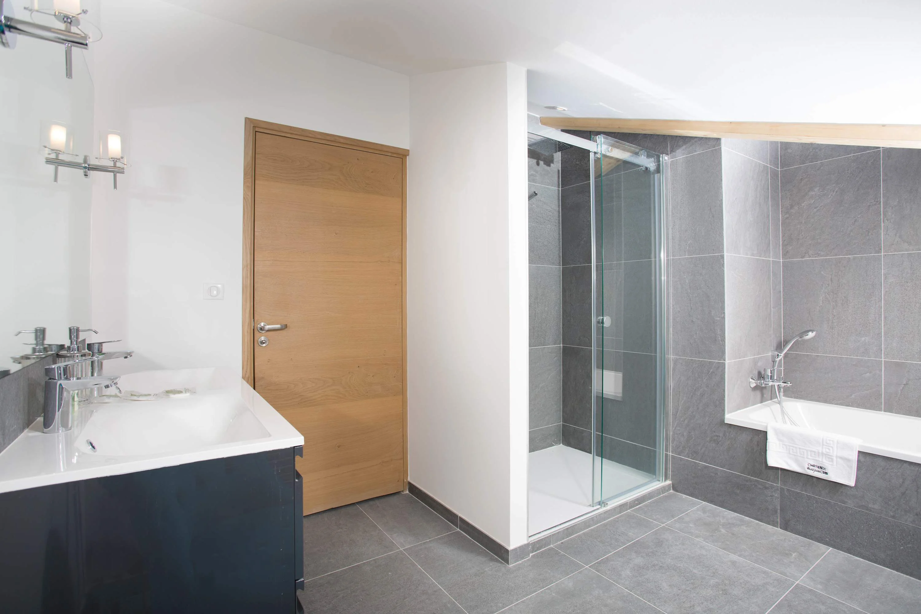 Family bathroom for second and third bedrooms with bath and Italian shower