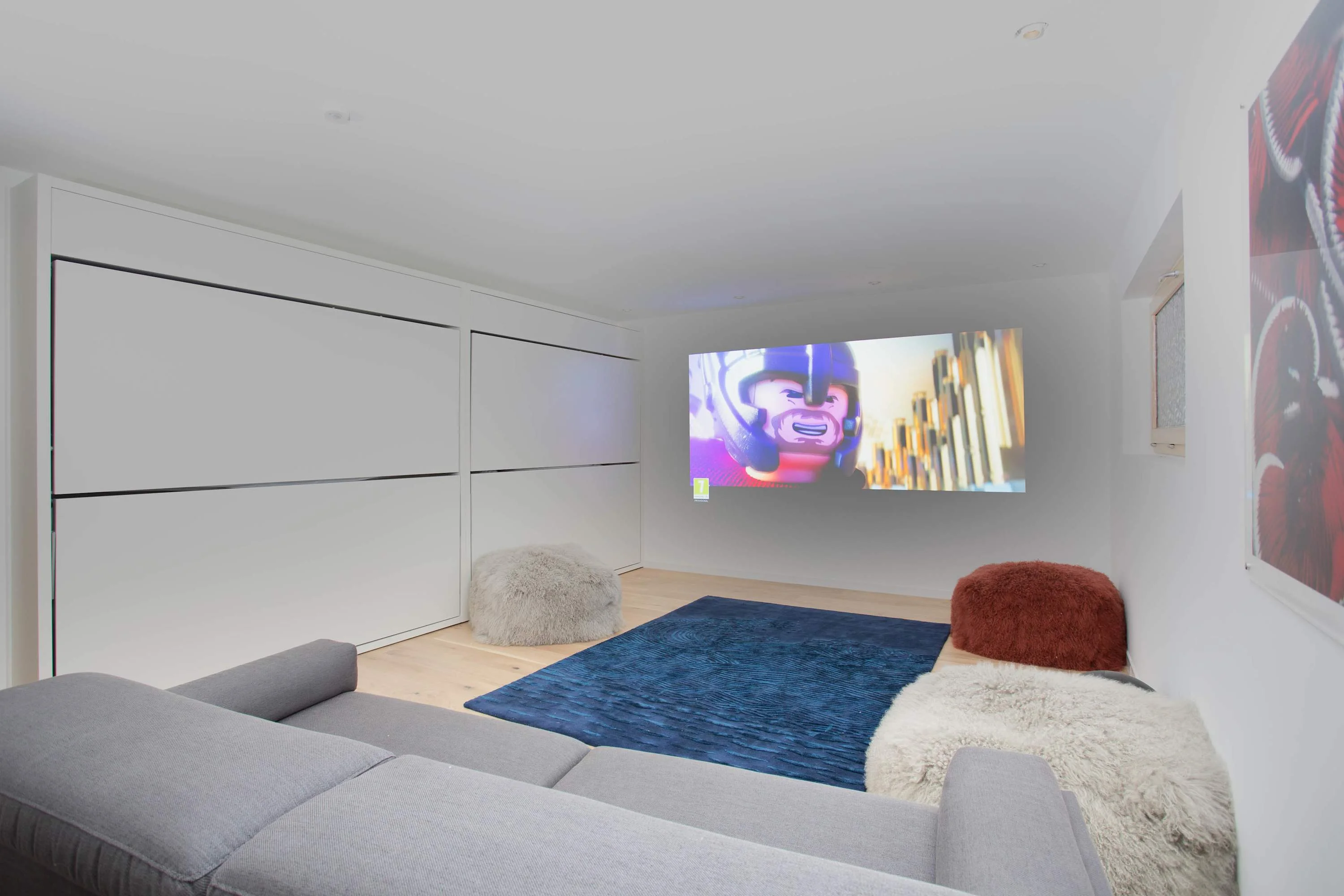 Bunk beds can stow away to transform into a cinema room with plenty of cosy seating