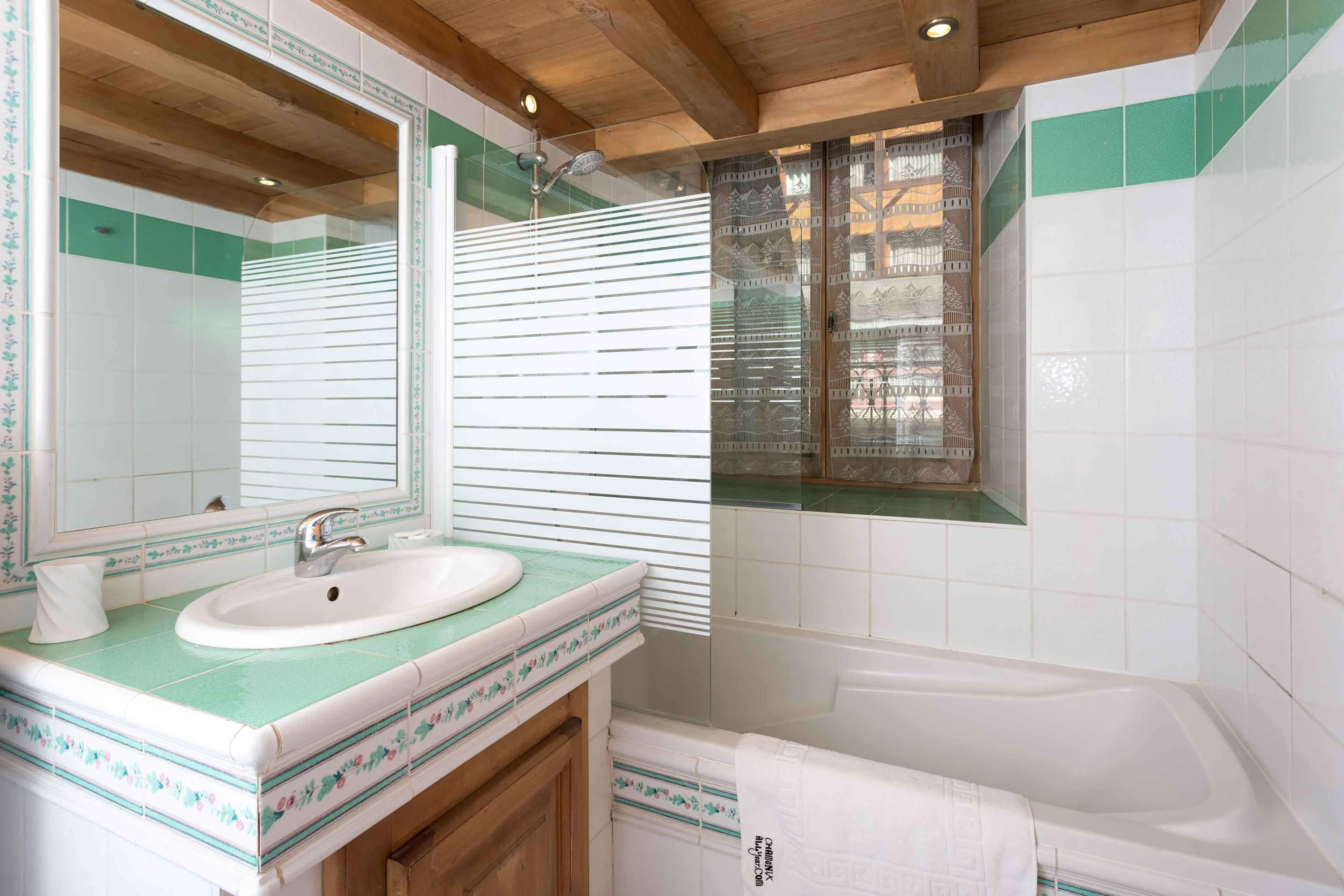 Bathroom with bath and shower