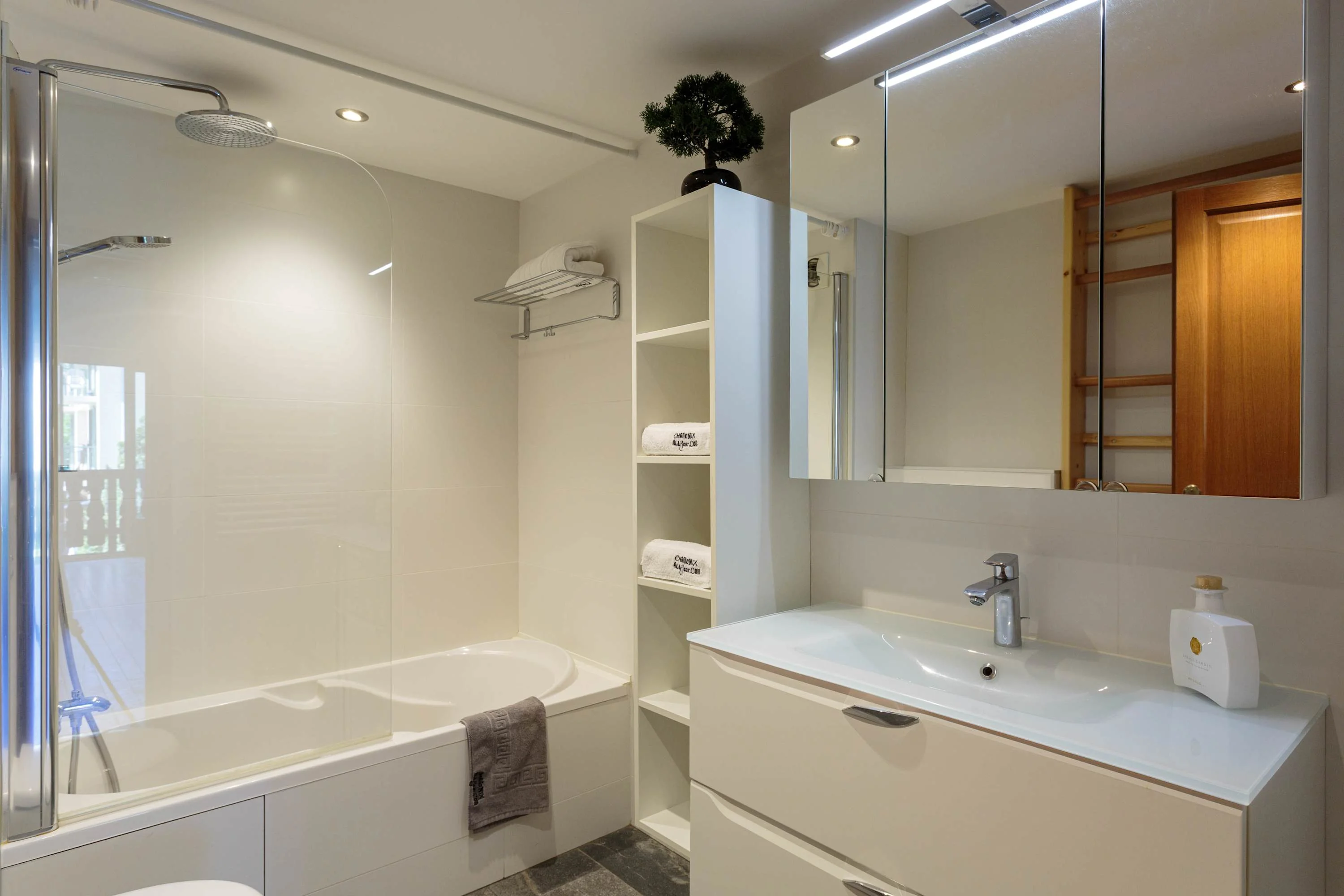 Family bathroom with shower over bath