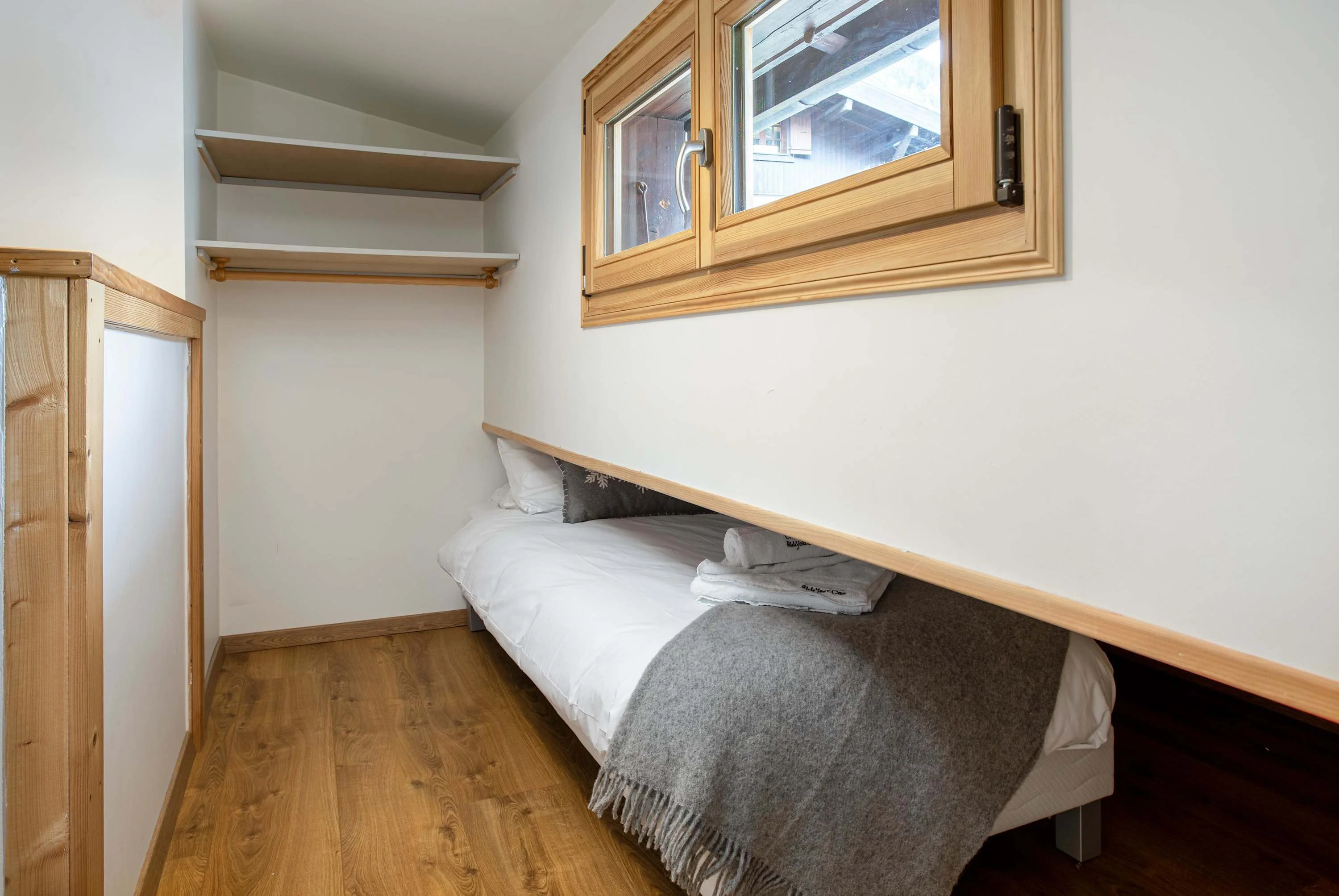 Second room with 2 small single beds that push into the eaves