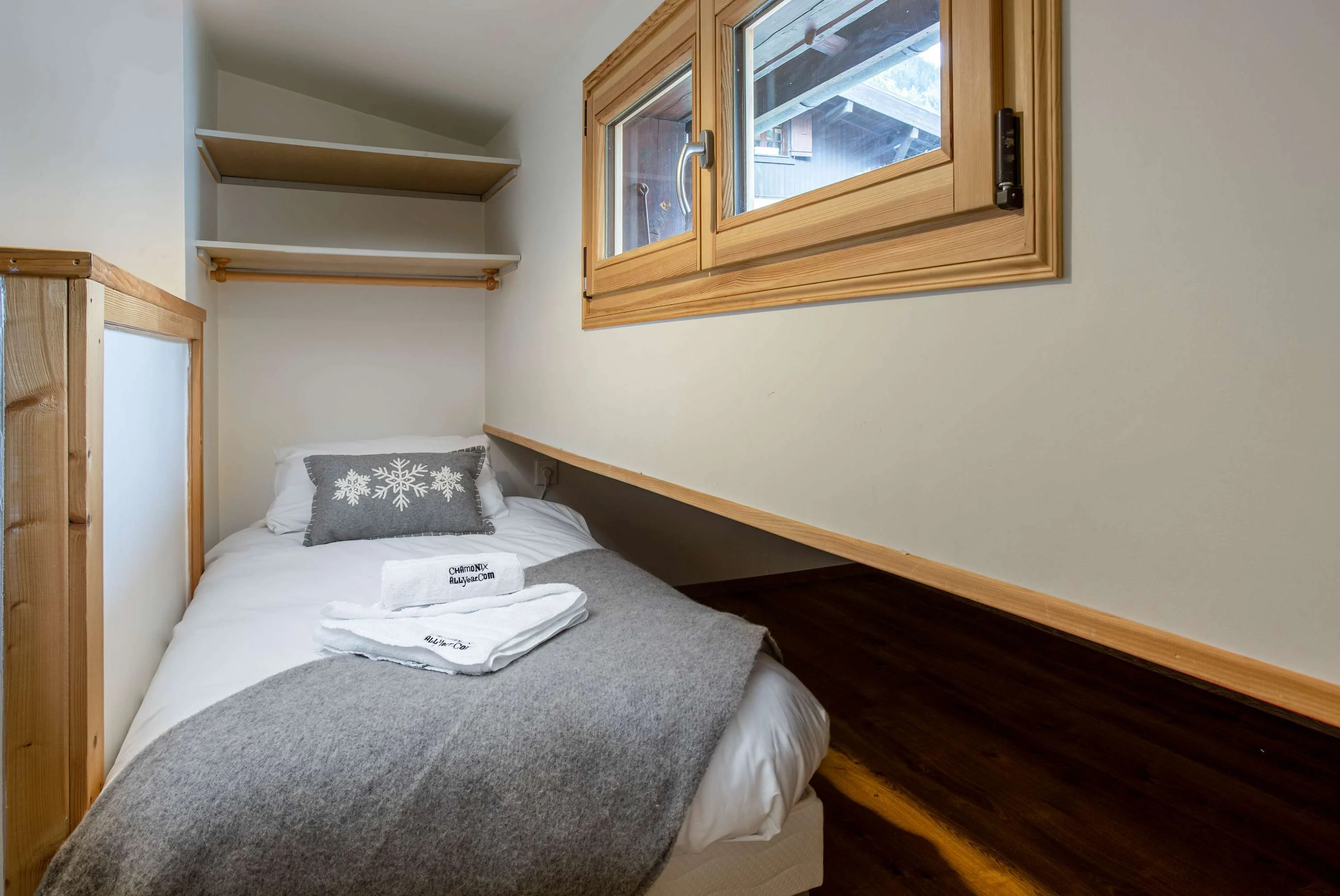 Second room with 2 small single beds that push into the eaves