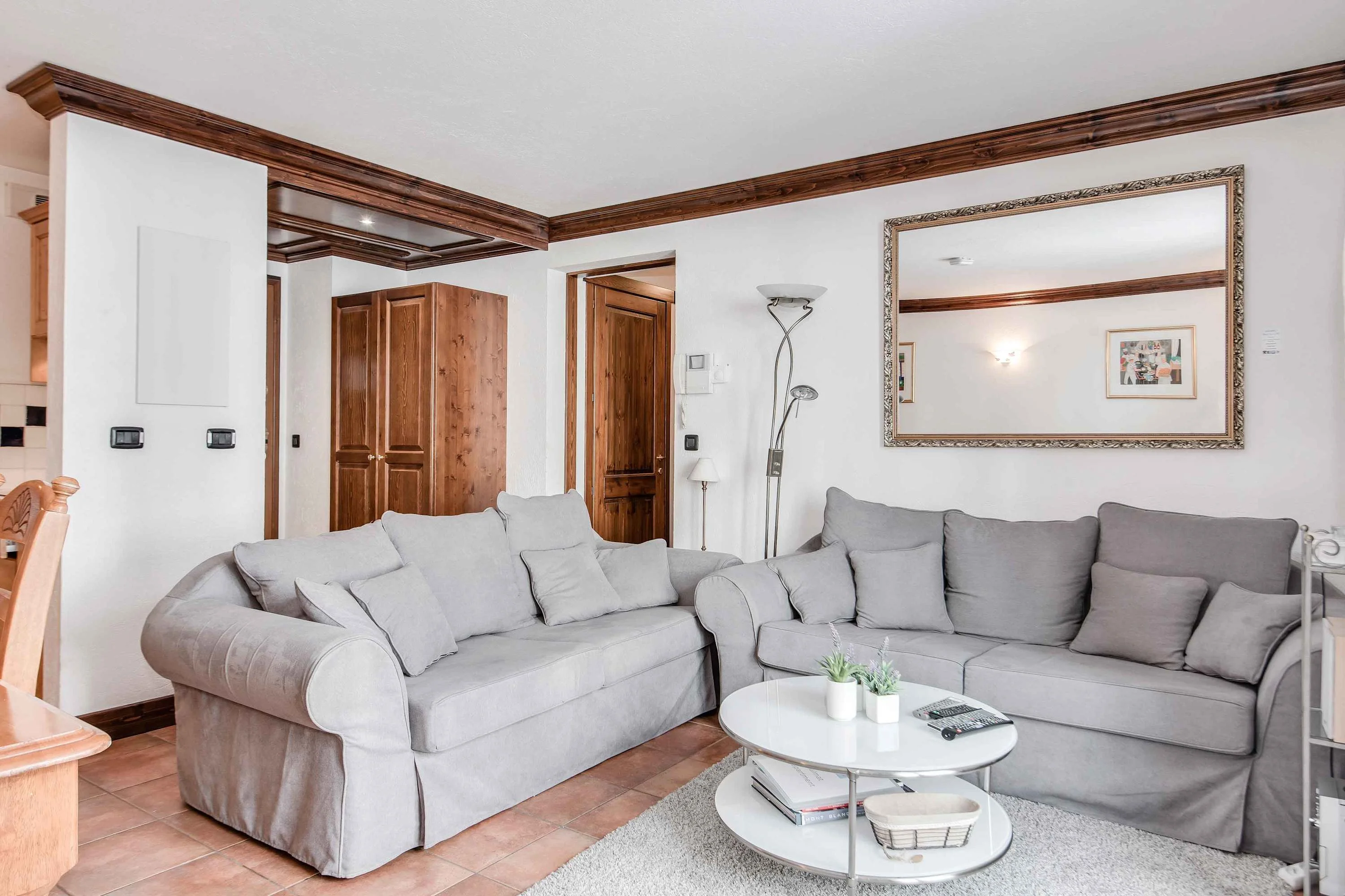Living room has 2 sofas including a double sofa bed