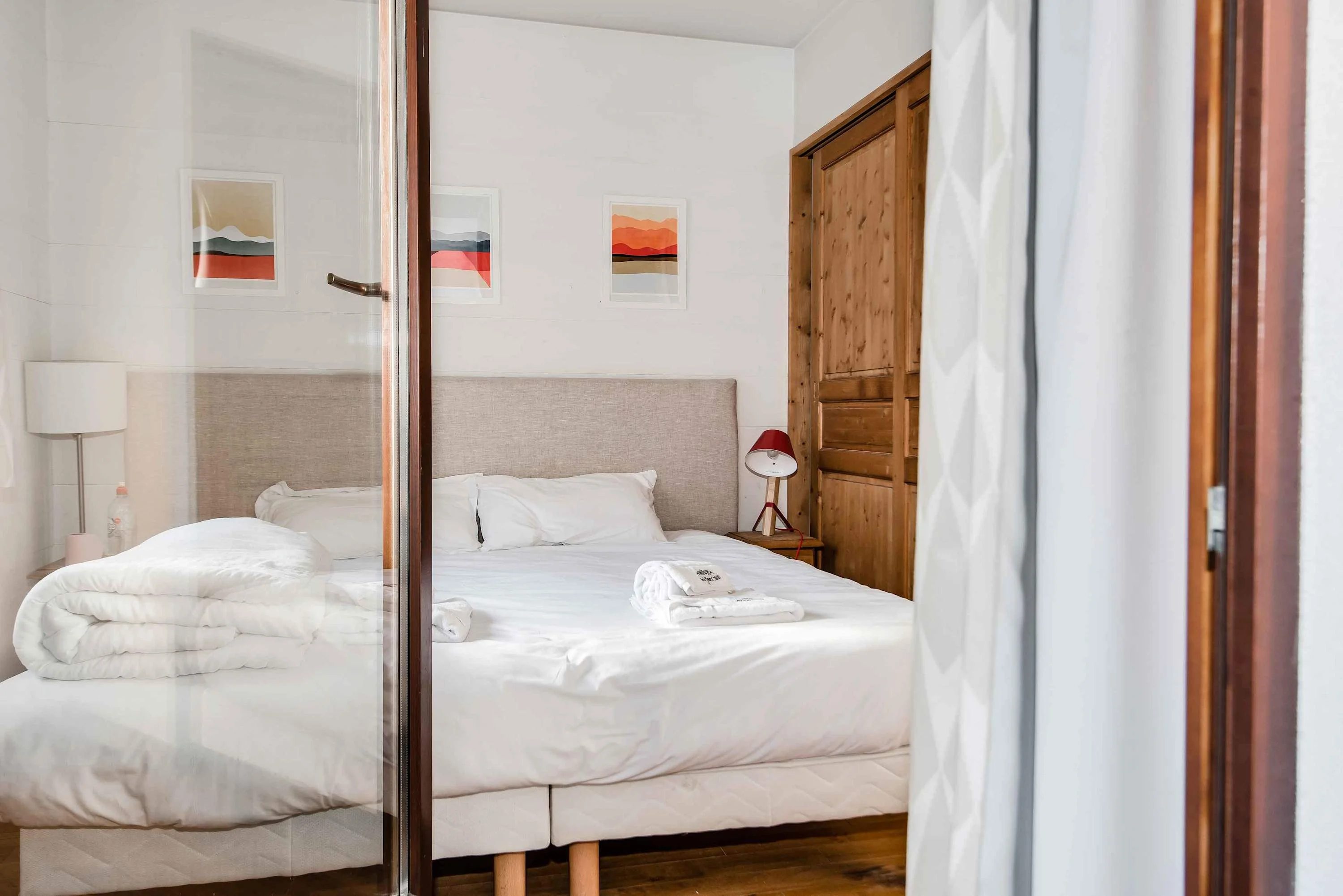 Bedroom 1 shares access to the second balcony