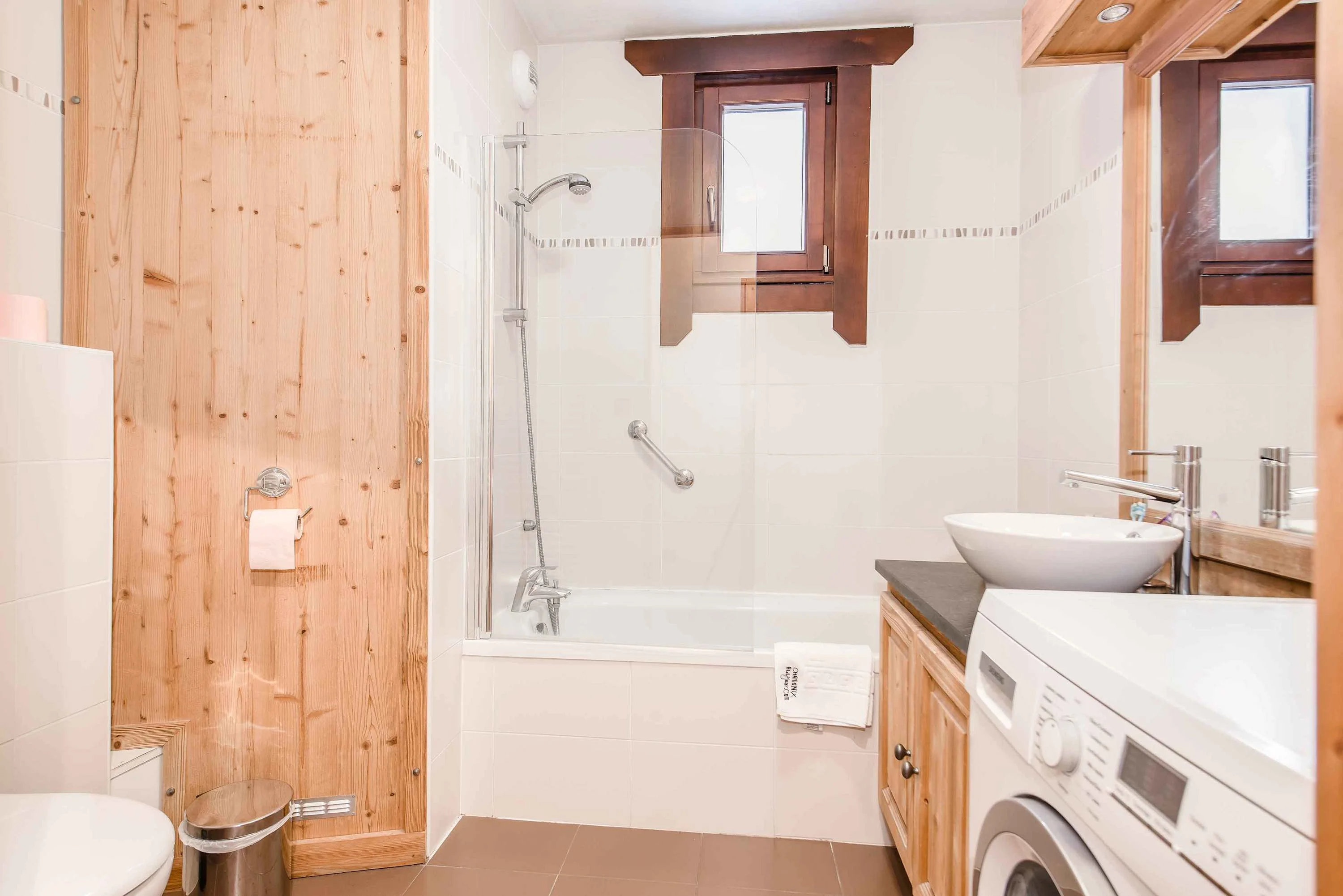 Family bathroom with bath and washing machine