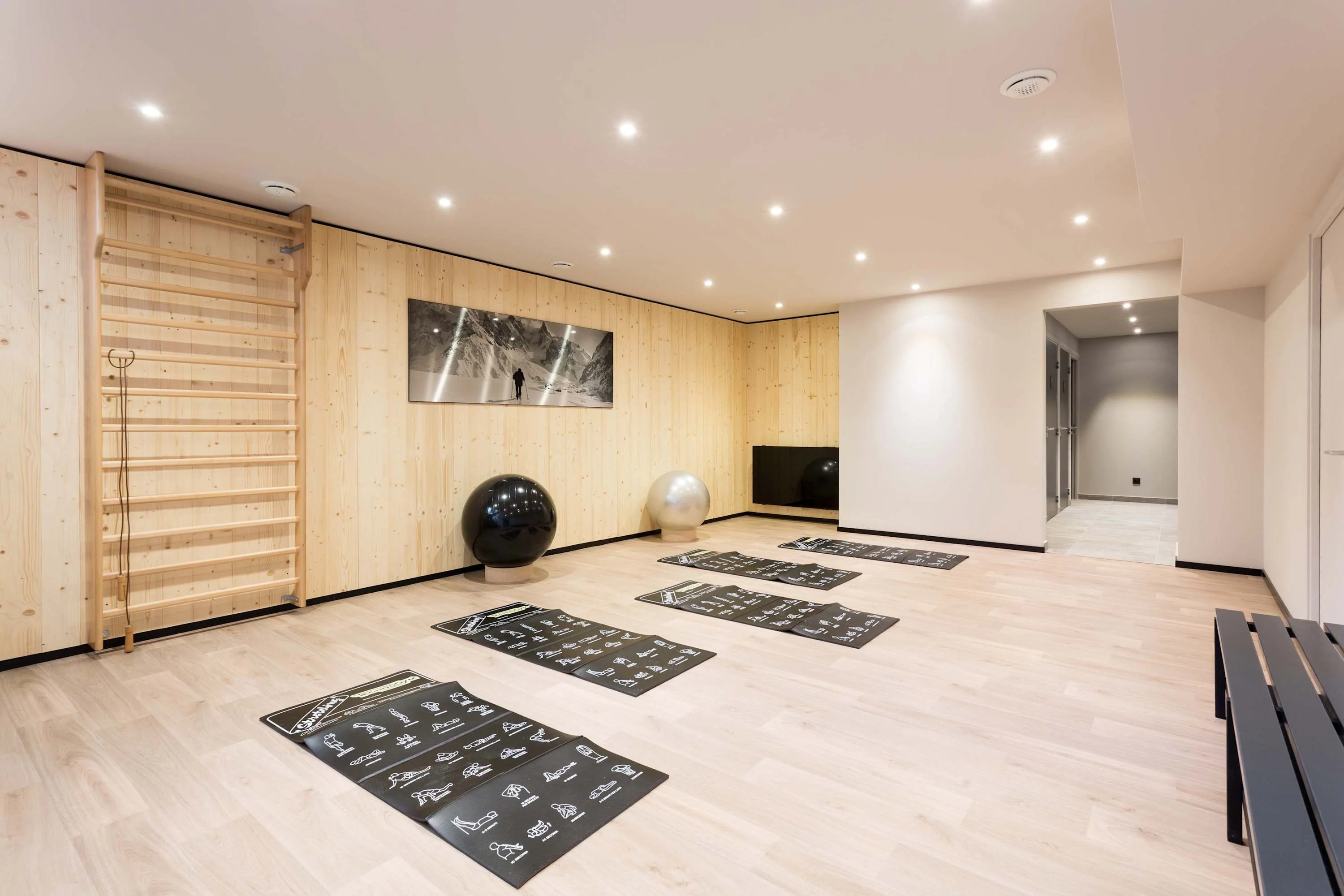 The lower level of the fitness room has swiss balls and exercise mats