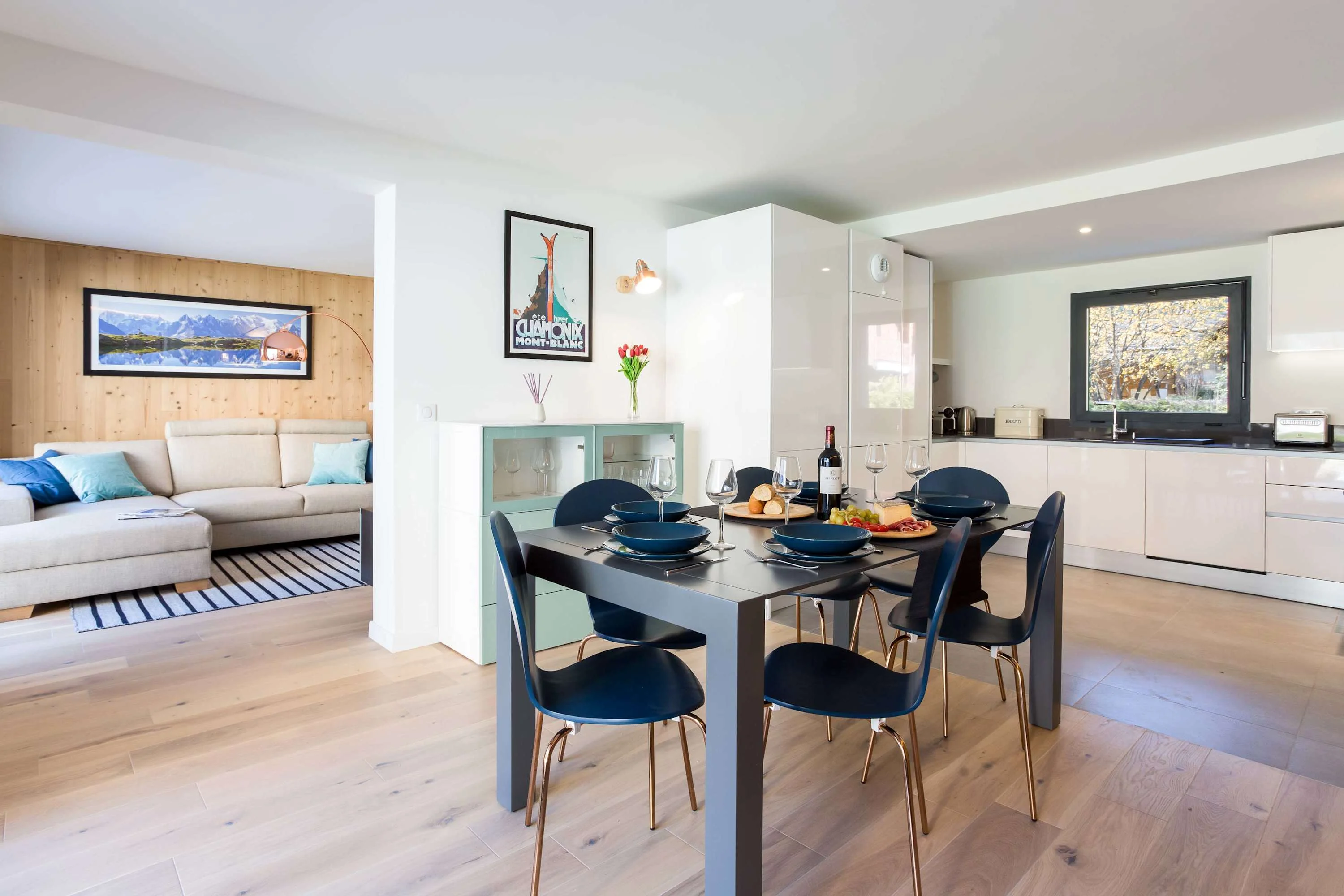 Interconnecting kitchen, living and dining areas in spacious apartment