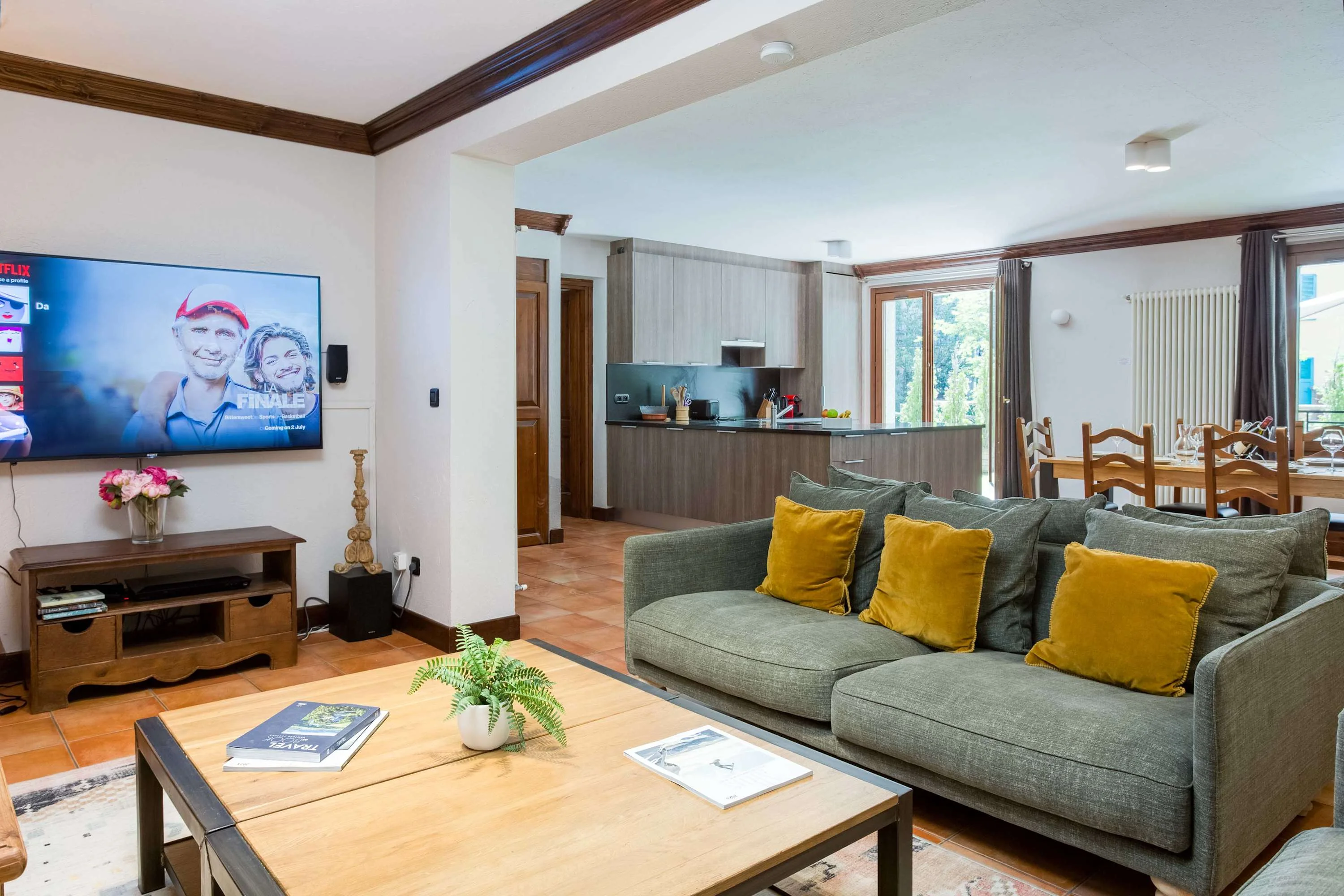Cosy lounge area with large TV and sofa bed